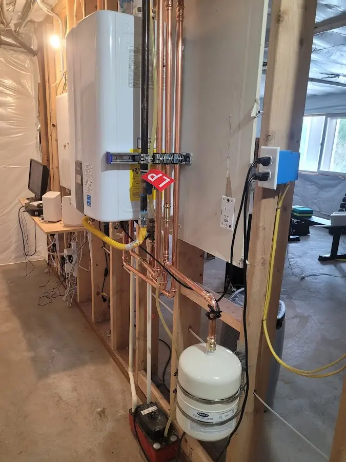 Licensed plumber repairing a kitchen sink in Malden