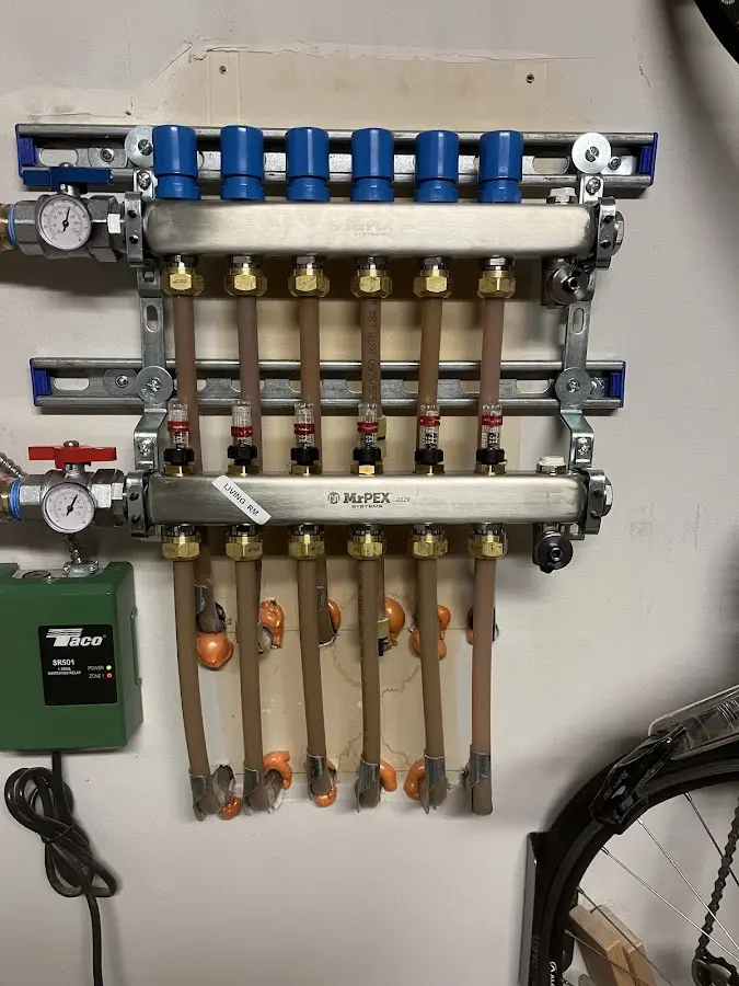 Plumber performing Water Heater Repair at a residential property in Malden